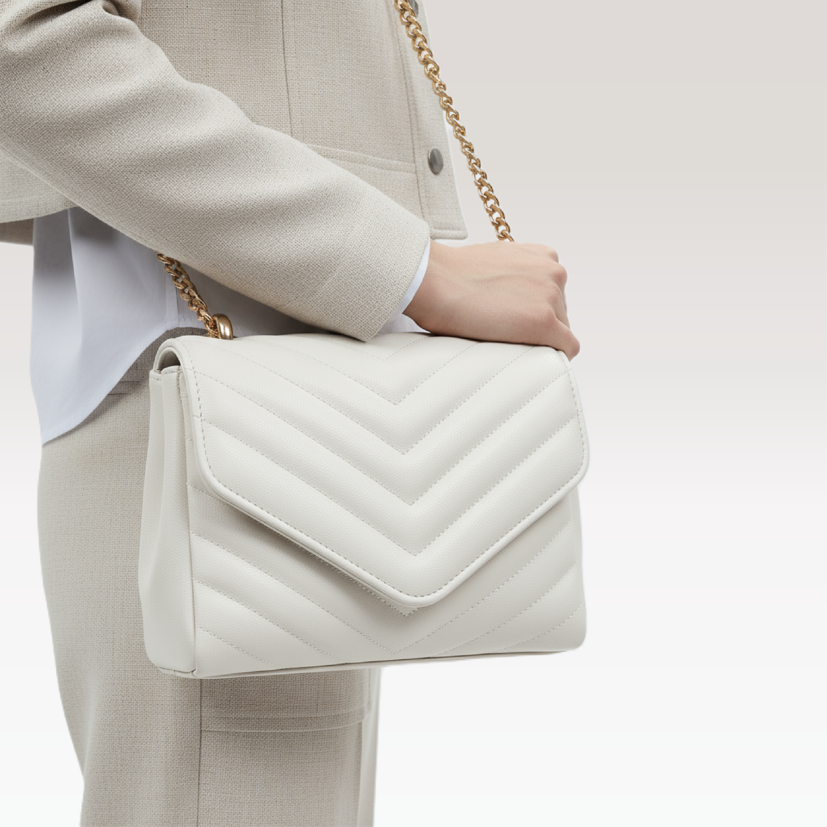 ARCANGELLIS_Azraelle_quilted_vegan_leather_crossbody_bag_in_White_-_Model_Zoomed_View